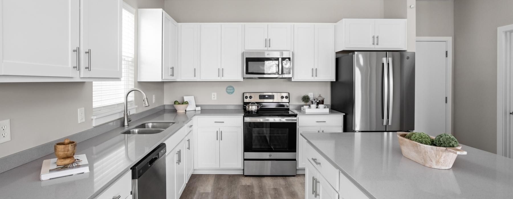 a kitchen with white cabinets