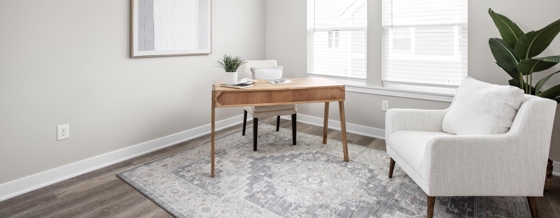 a living room with a table and chairs